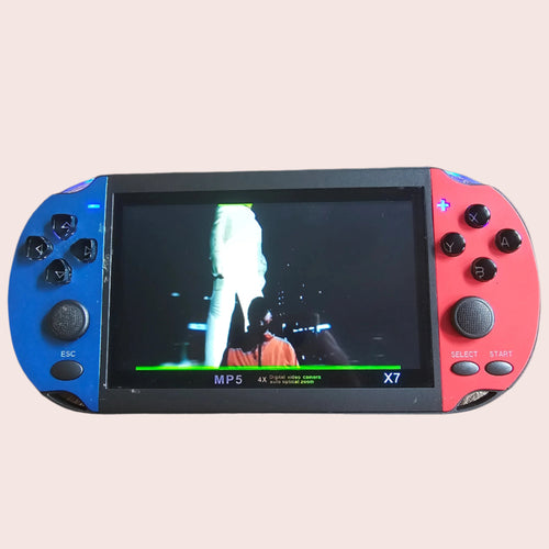 Handheld gaming console with a screen displaying a game on a textured surface
